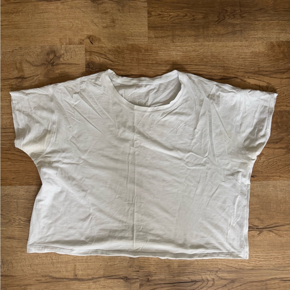 Lululemon white top. Unsure of size but likely medium. Cropped